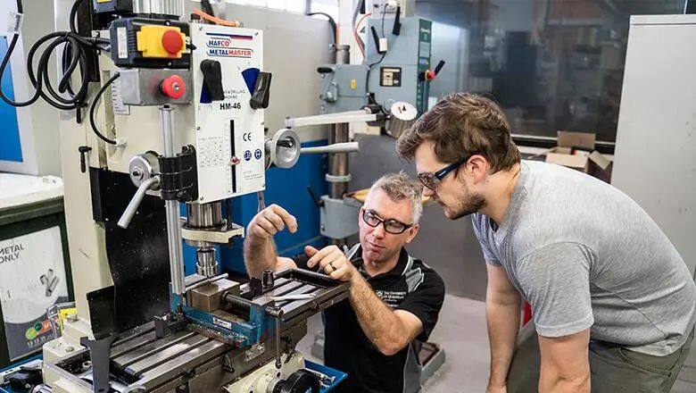 A student and teacher in UQ's Makerspace